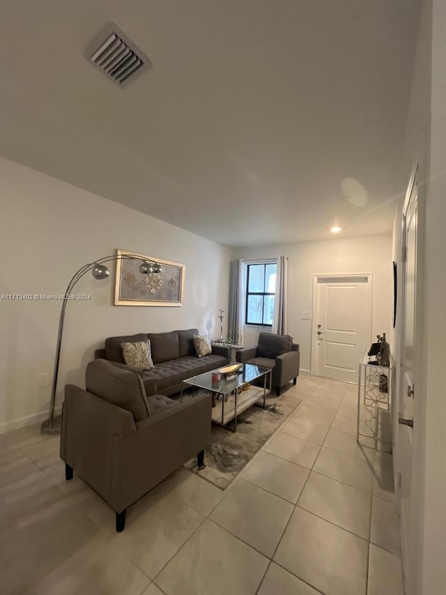 living room with light tile patterned floors