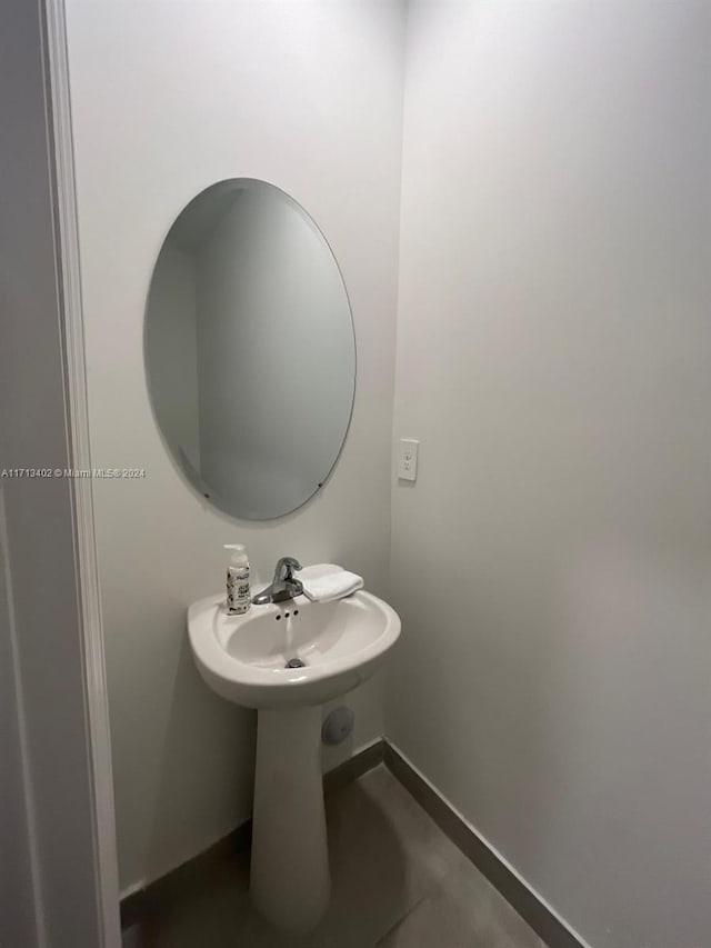 bathroom with tile patterned flooring