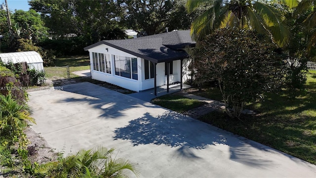 view of property exterior with a yard