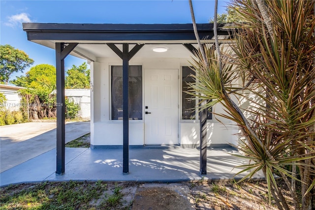 property entrance with a patio area