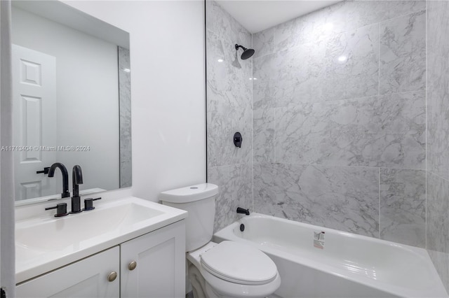 full bathroom featuring vanity, toilet, and tiled shower / bath