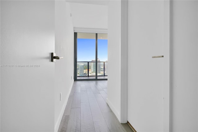 hallway with floor to ceiling windows