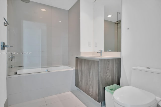 full bathroom with tile patterned flooring, vanity, toilet, and tiled shower / bath combo