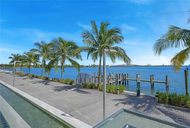 exterior space featuring a boat dock and a water view