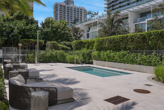 view of pool featuring a patio area