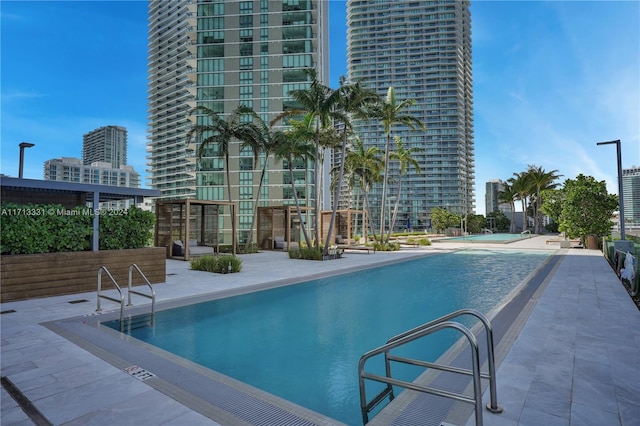 view of swimming pool featuring a patio area