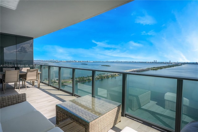 balcony featuring a water view