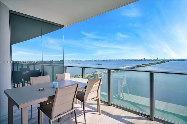 balcony featuring a water view