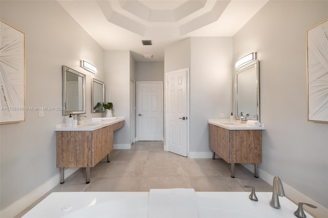 bathroom featuring vanity and a raised ceiling