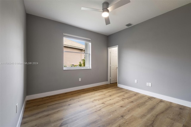 unfurnished room featuring ceiling fan and light wood-type flooring