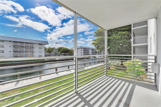 balcony featuring a water view