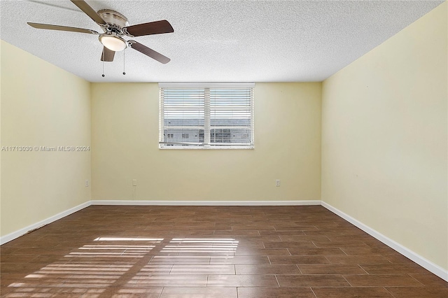 empty room with ceiling fan and a textured ceiling