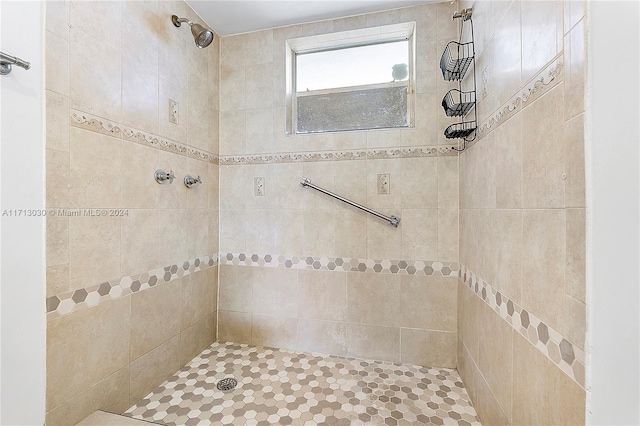 bathroom featuring tiled shower