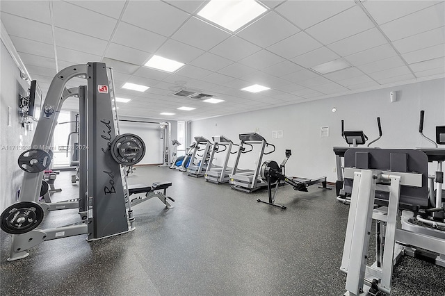 exercise room with a drop ceiling