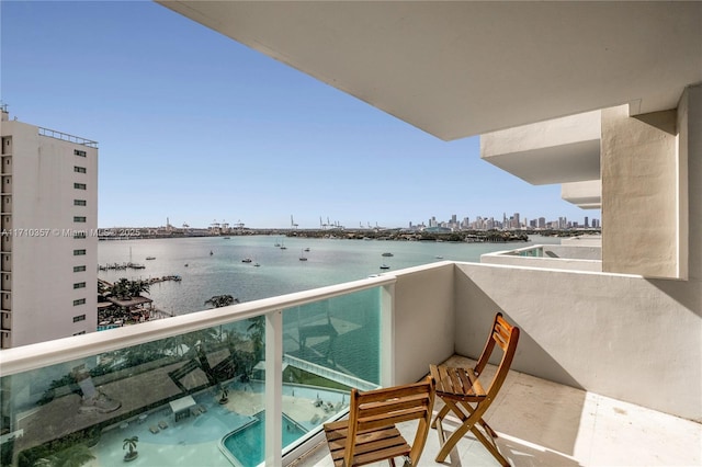 balcony featuring a water view