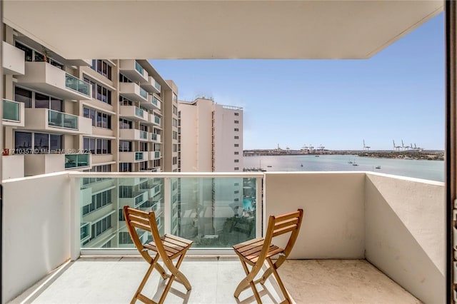 balcony featuring a water view