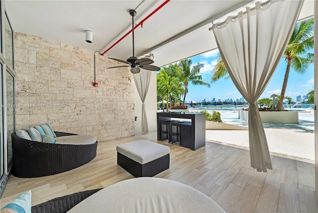 view of patio / terrace featuring ceiling fan