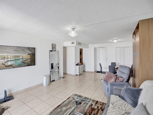 tiled living room with a textured ceiling