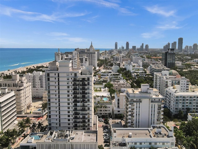 view of city featuring a water view and a view of the beach