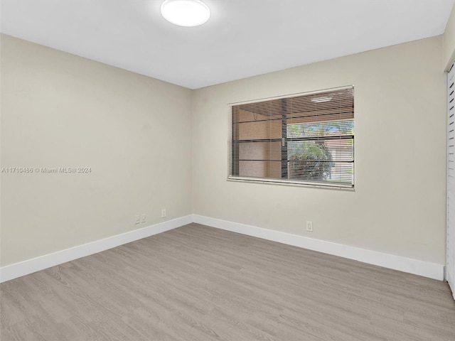 spare room with light wood-type flooring