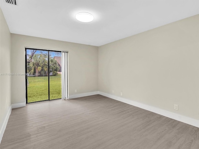 unfurnished room with light hardwood / wood-style flooring