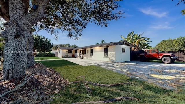 ranch-style house with a front yard