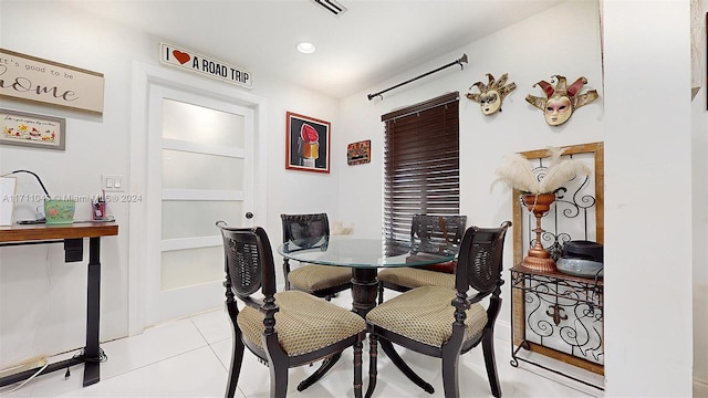 dining area with light tile patterned flooring