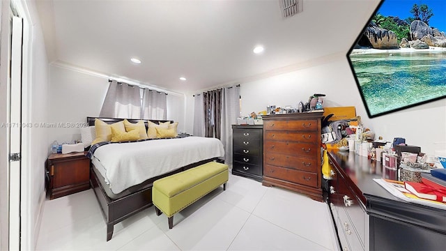 bedroom with light tile patterned flooring and ornamental molding