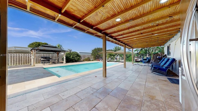 view of pool featuring a gazebo and a patio