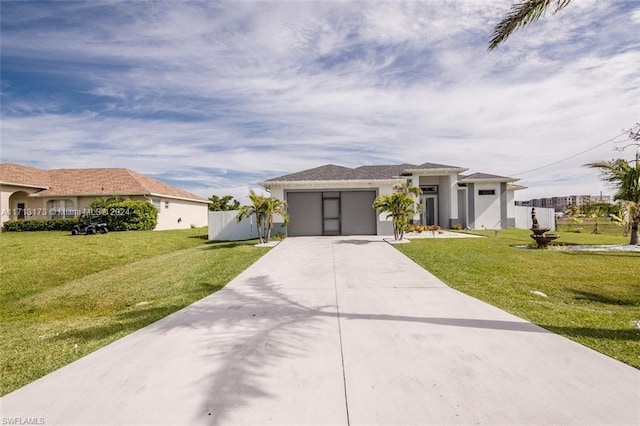 view of front of property with a front lawn and a garage