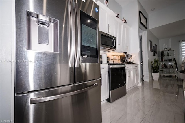 kitchen featuring white cabinets and appliances with stainless steel finishes