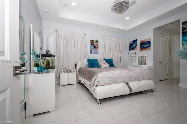 bedroom featuring a raised ceiling