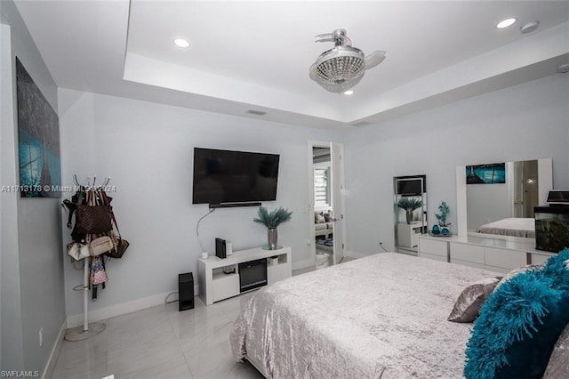 bedroom with a raised ceiling