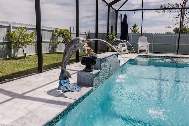 view of pool featuring a lanai, a patio area, and pool water feature