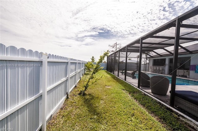 view of yard featuring a patio area, a lanai, and a fenced in pool