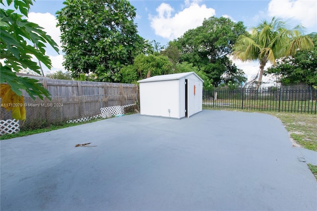 view of patio / terrace with a shed