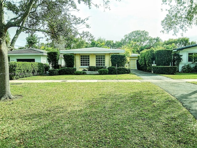 410 Miller Rd, Coral Gables, FL 33146 - single story home featuring a front yard and driveway