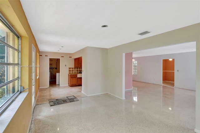 410 Miller Rd, Coral Gables, FL 33146 - unfurnished room featuring dark speckled floor and baseboards