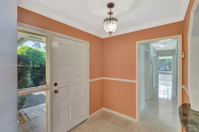 410 Miller Rd, Coral Gables, FL 33146 - entrance foyer featuring a chandelier and baseboards