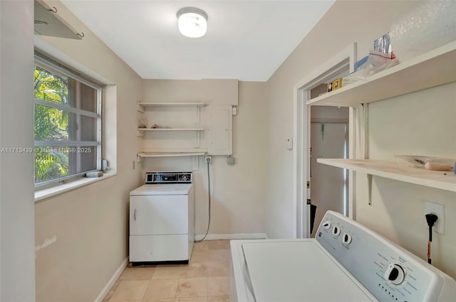 410 Miller Rd, Coral Gables, FL 33146 - laundry area featuring washing machine and clothes dryer, baseboards, and light tile patterned floors
