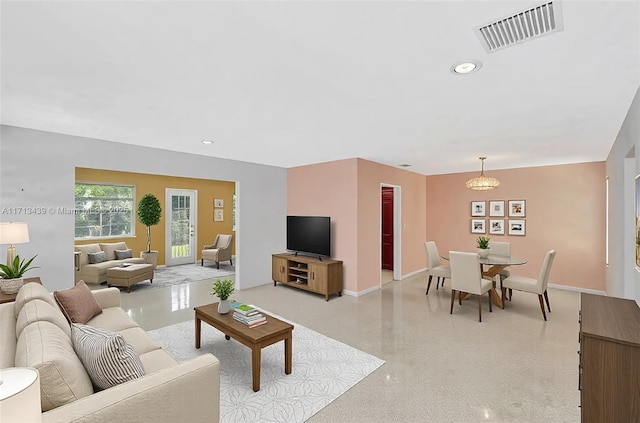 410 Miller Rd, Coral Gables, FL 33146 - living room featuring baseboards, dark aggregate flooring, and recessed lighting