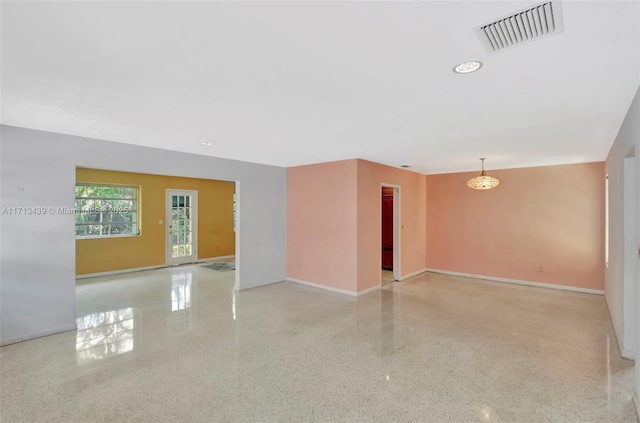 410 Miller Rd, Coral Gables, FL 33146 - empty room with speckled floor, baseboards, a chandelier, and recessed lighting