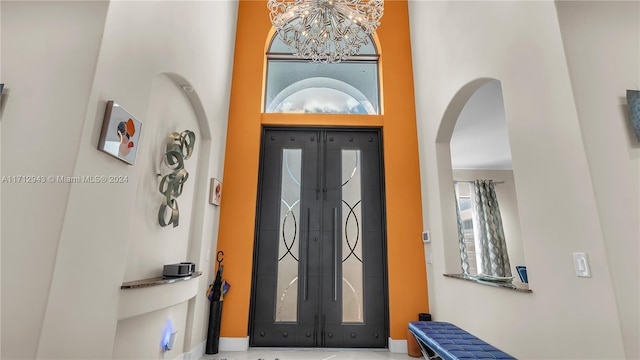 entrance foyer featuring a notable chandelier