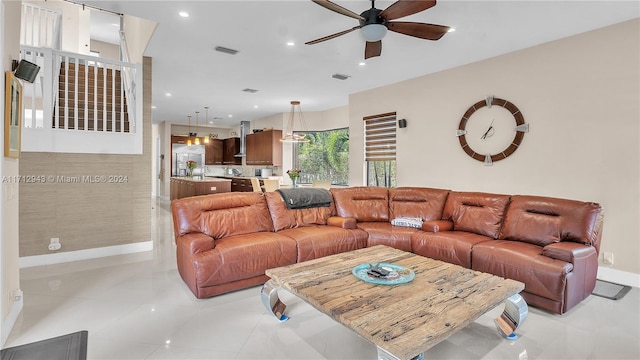 tiled living room featuring ceiling fan