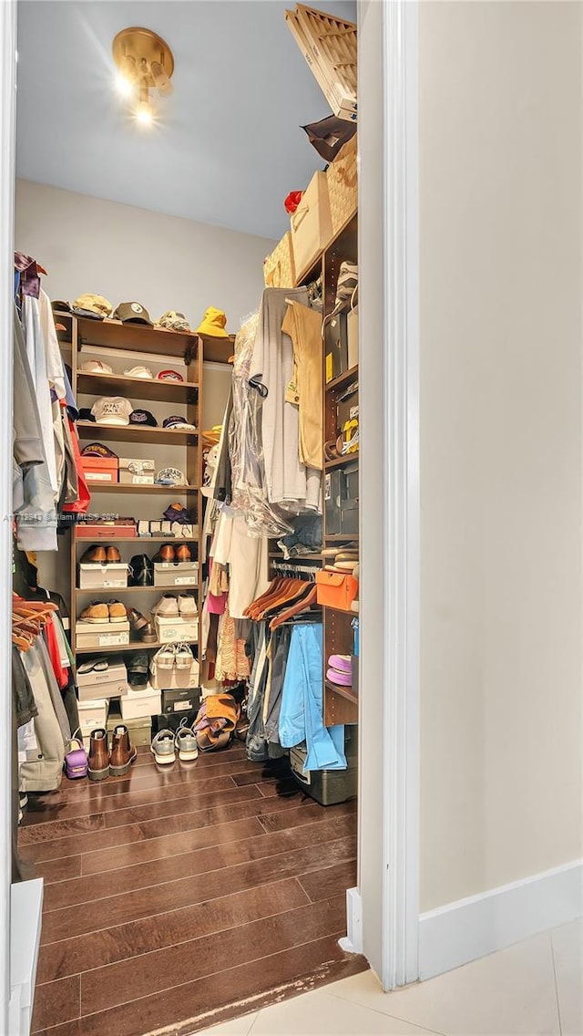 spacious closet featuring hardwood / wood-style flooring