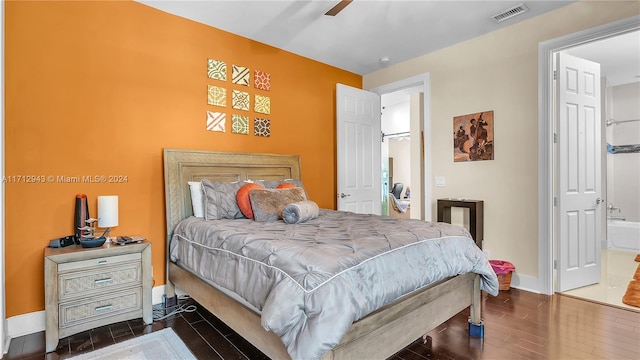 bedroom with ensuite bathroom and ceiling fan