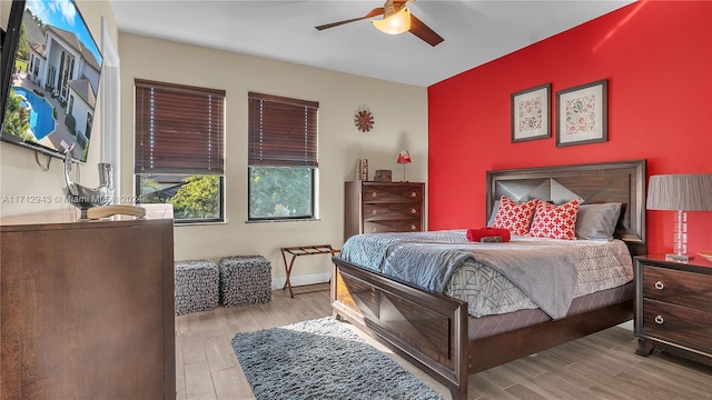 bedroom featuring light hardwood / wood-style flooring and ceiling fan