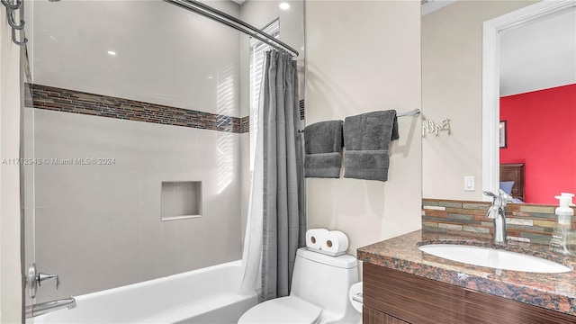 full bathroom with vanity, toilet, shower / bath combo with shower curtain, and backsplash