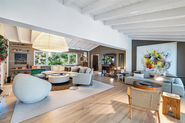 living room with lofted ceiling with beams and wood-type flooring