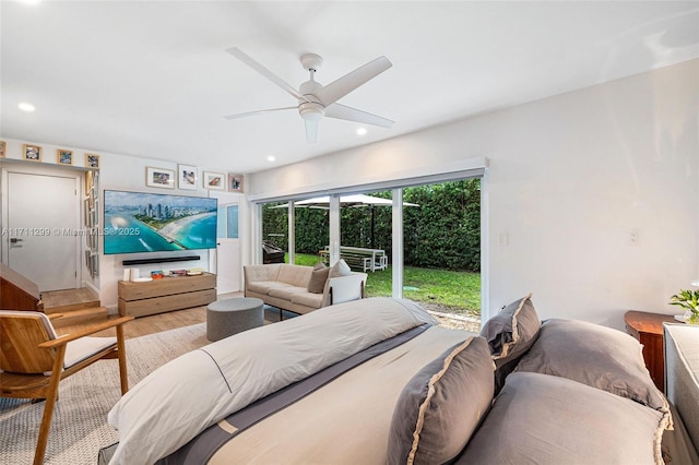 bedroom featuring access to outside, ceiling fan, and light wood-type flooring